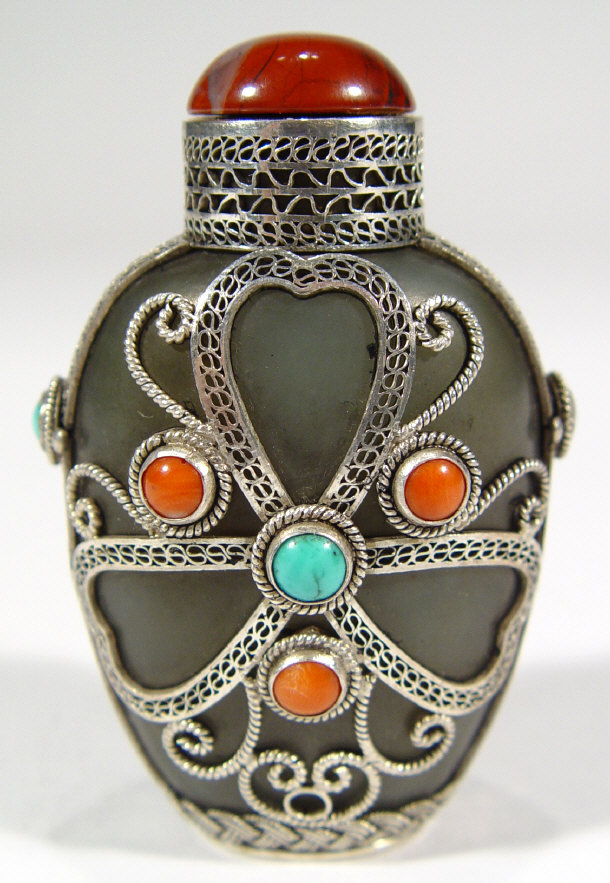 Appraisal: Chinese olive green and jade snuff bottle decorated with filigree