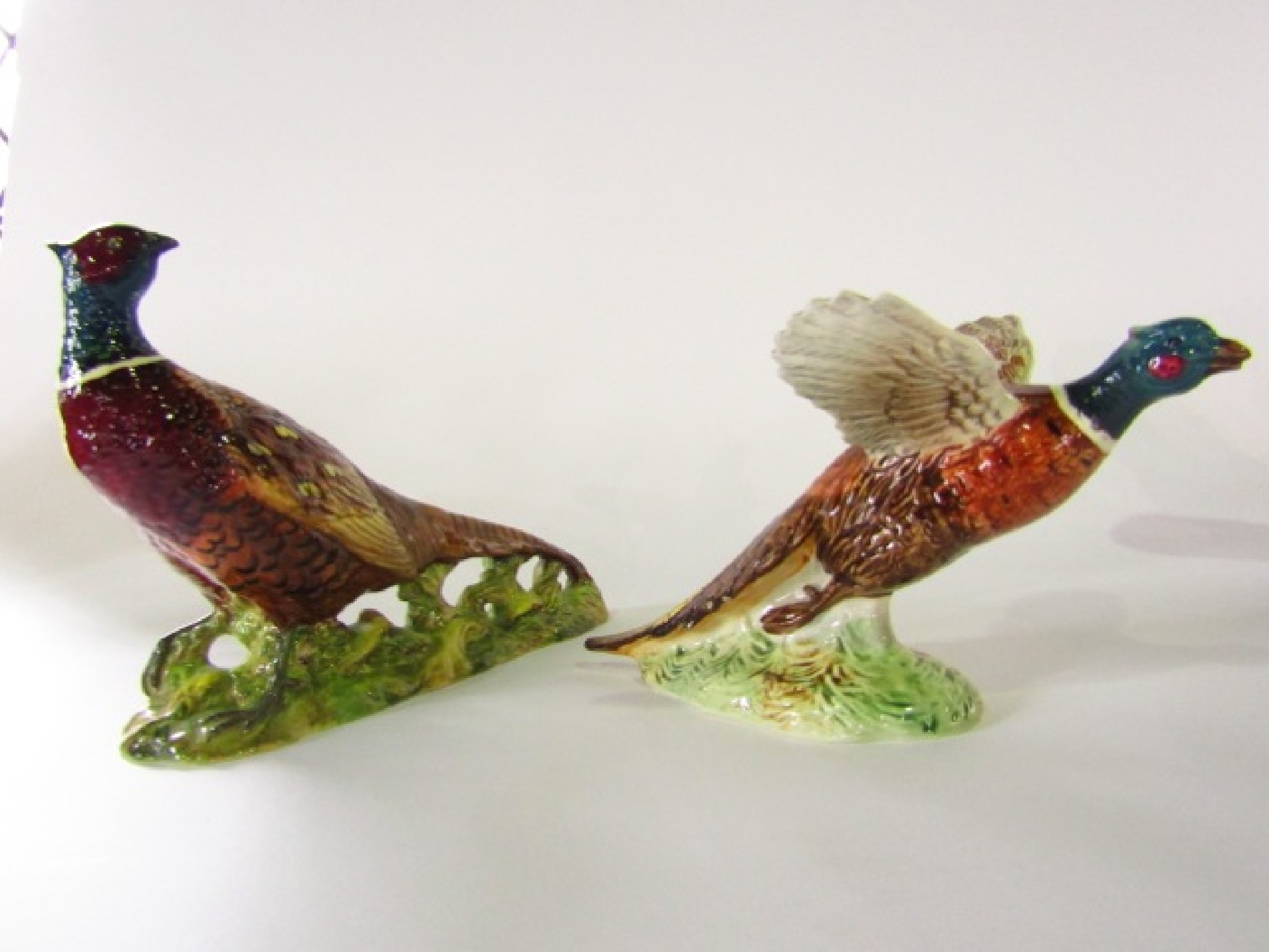 Appraisal: A Beswick model of a pheasant with outstretched wings and