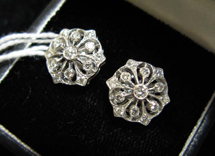 Appraisal: PAIR OF DIAMOND AND EIGHTEEN KARAT WHITE GOLD EAR STUDS