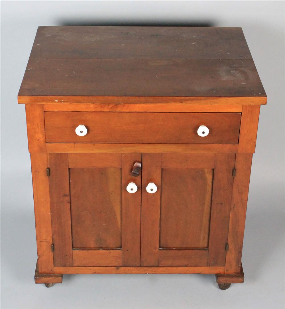 Appraisal: AMERICAN CHERRY WASHSTAND With a long drawer above two paneled