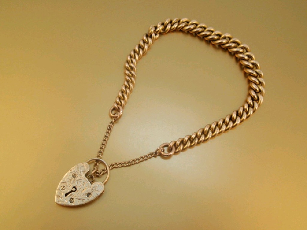 Appraisal: A ct gold curb link bracelet with padlock clasp g