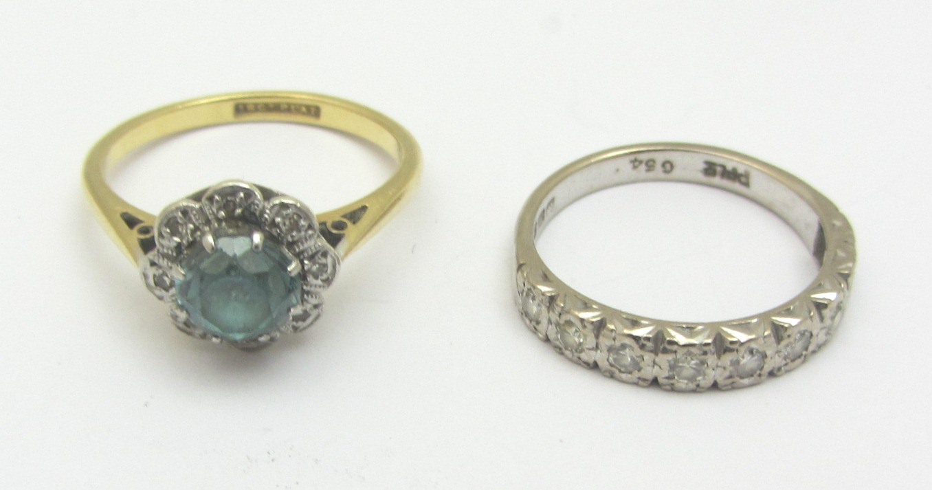 Appraisal: A gold and platinum blue zircon and diamond set nine