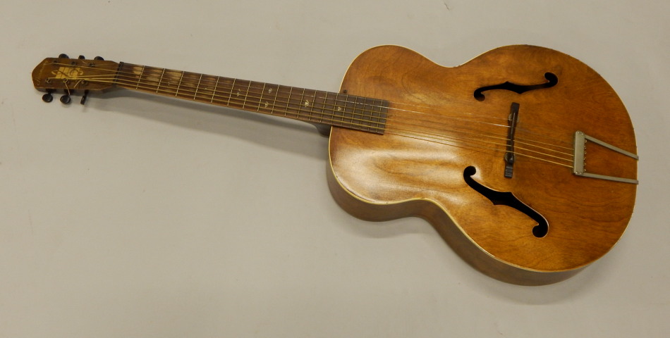 Appraisal: An American Harmony acoustic guitar cm long