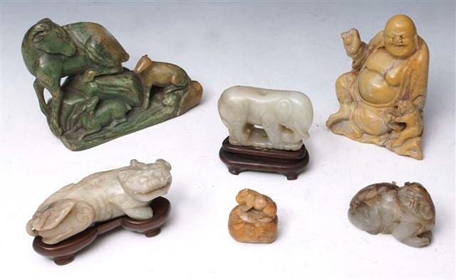 Appraisal: A CHINESE JADE carving of a recumbant beast and four