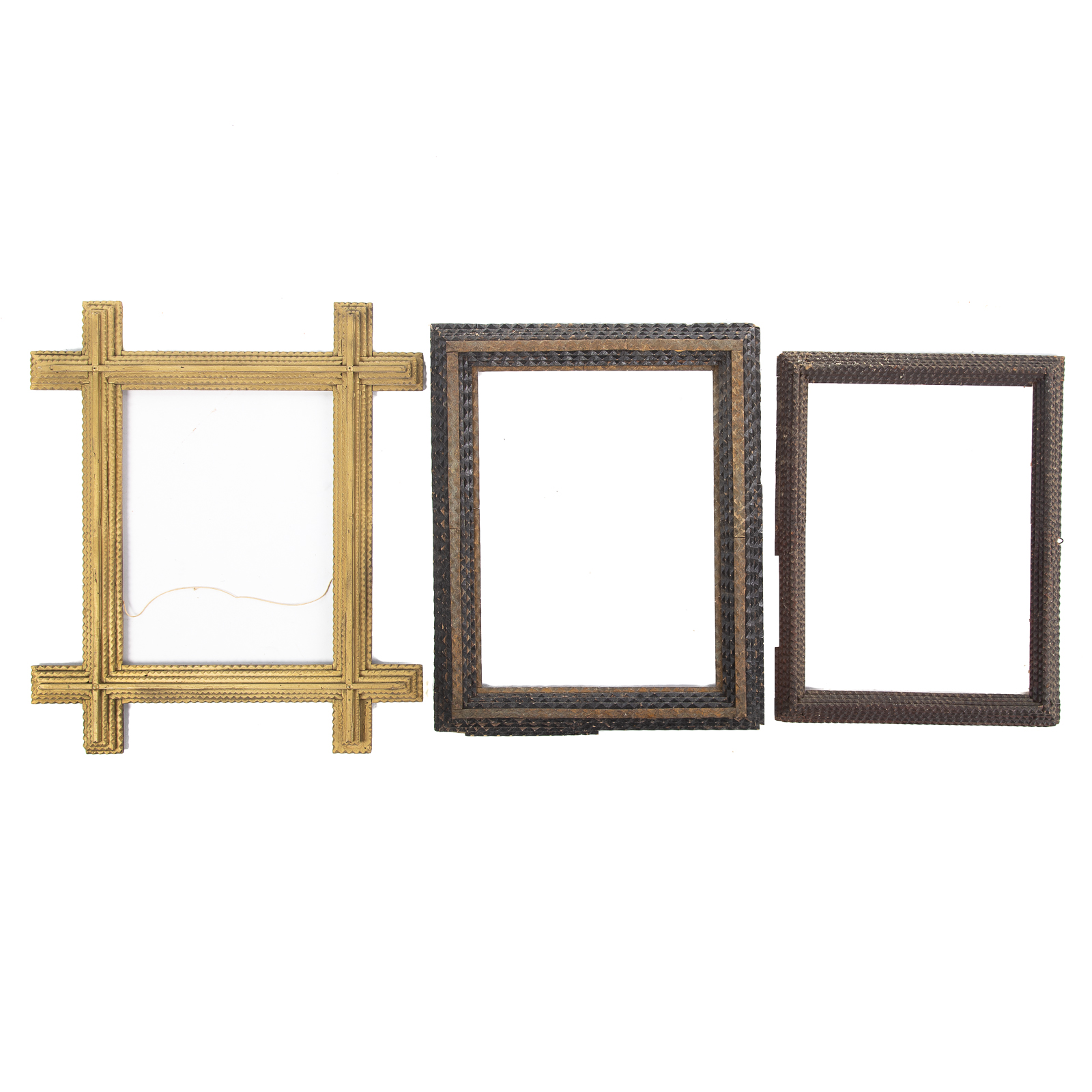 Appraisal: THREE TRAMP ART NOTCH CARVED FRAMES One gold painted size