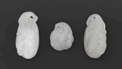 Appraisal: Three Carved Jade Pendants All three carved as a fruit