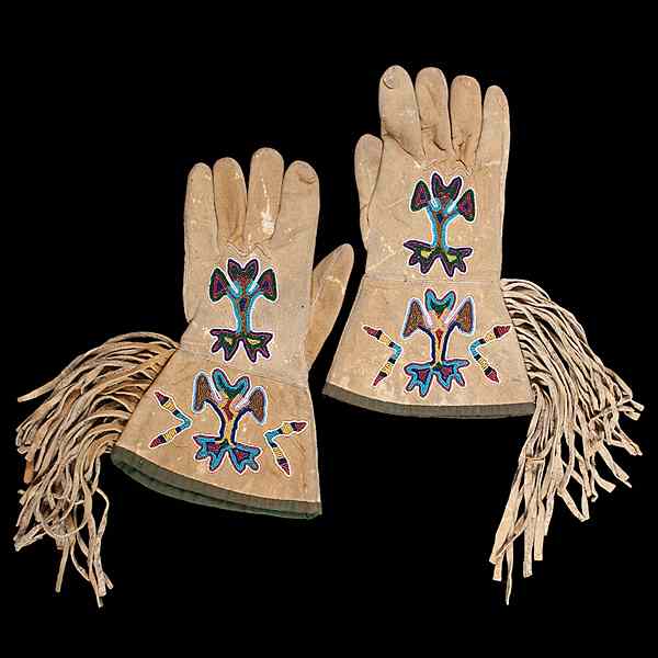 Appraisal: Crow Beaded Hide Gauntlets thread and sinew-sewn and decorated with