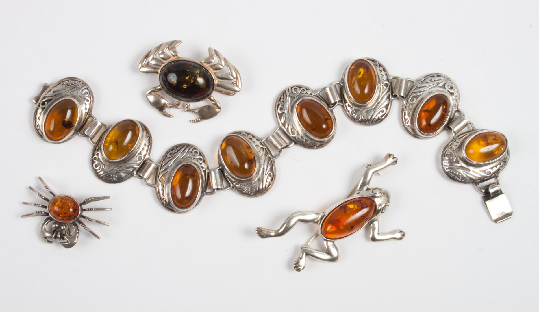 Appraisal: Group of sterling silver amber jewelry items including frog brooch