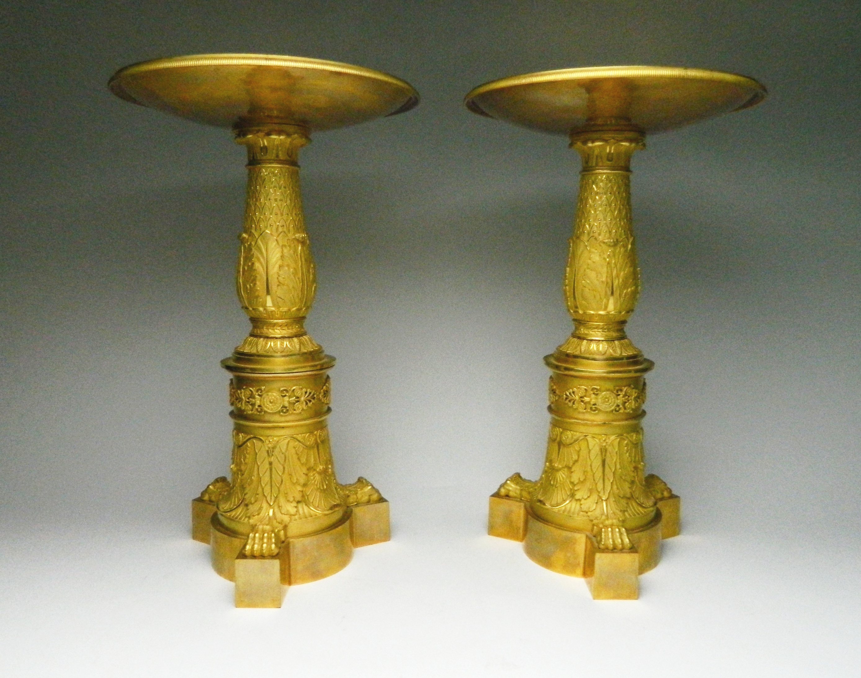 Appraisal: Pair of Empire gilt bronze Thomire Tazzas each with tapered