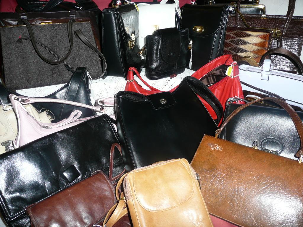 Appraisal: A large group of ladies handbags in various styles colours