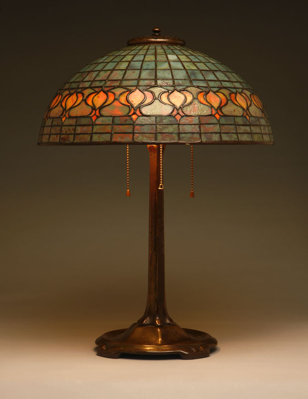 Appraisal: A Tiffany Studios bronze and leaded glass ''Pomegranate'' table lamp