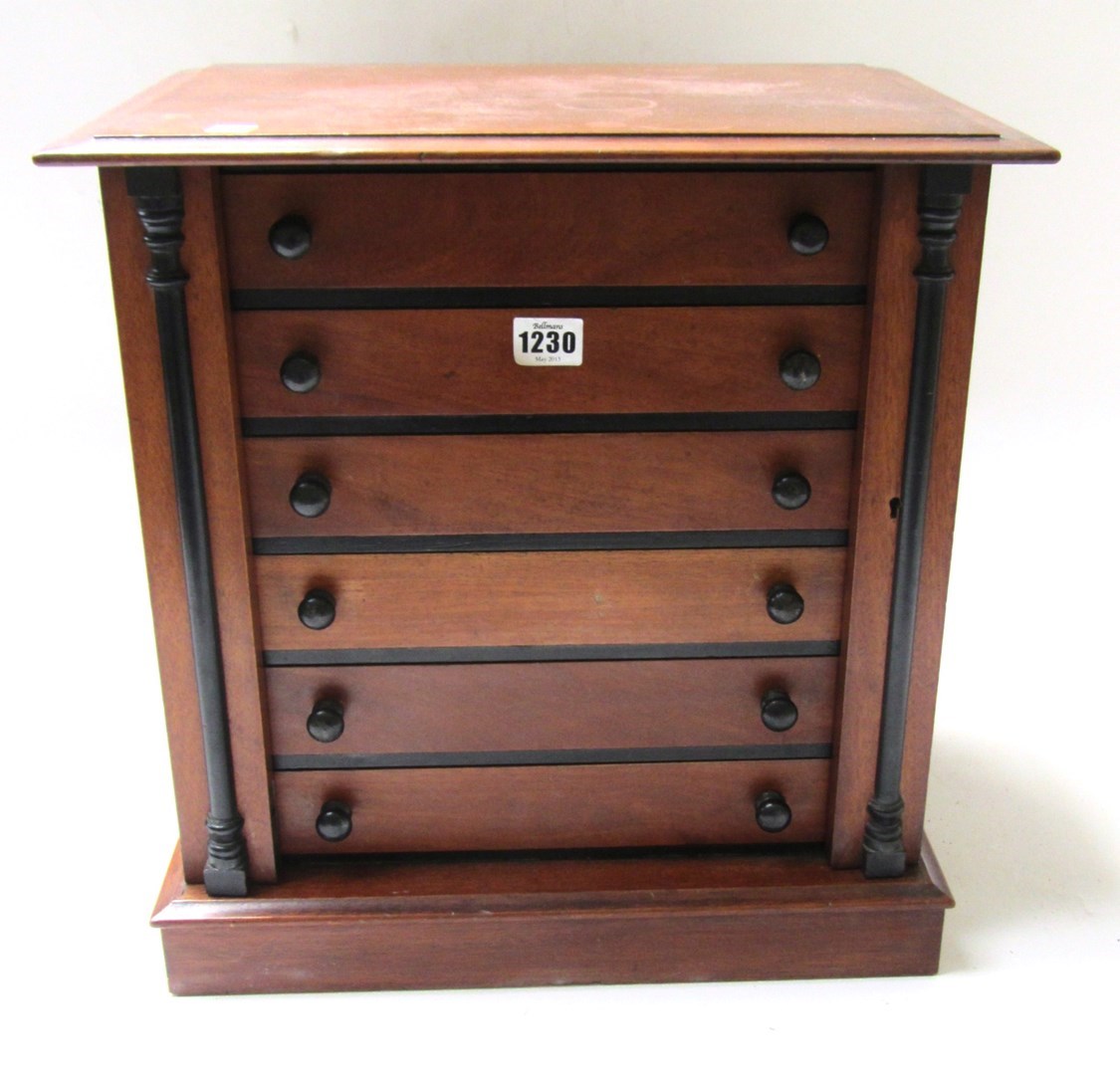 Appraisal: A Victorian mahogany and ebonised table top six drawer Wellington