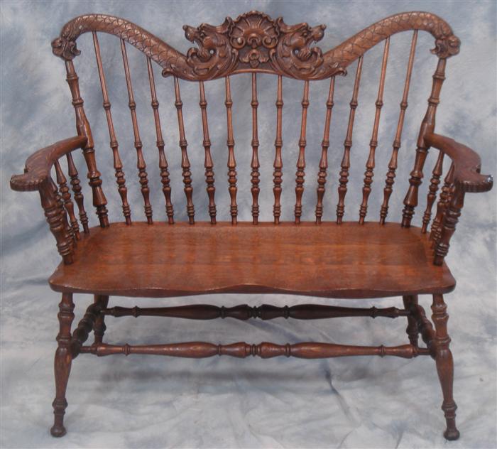 Appraisal: Lion carved Victorian oak spindle back settee refinished l h