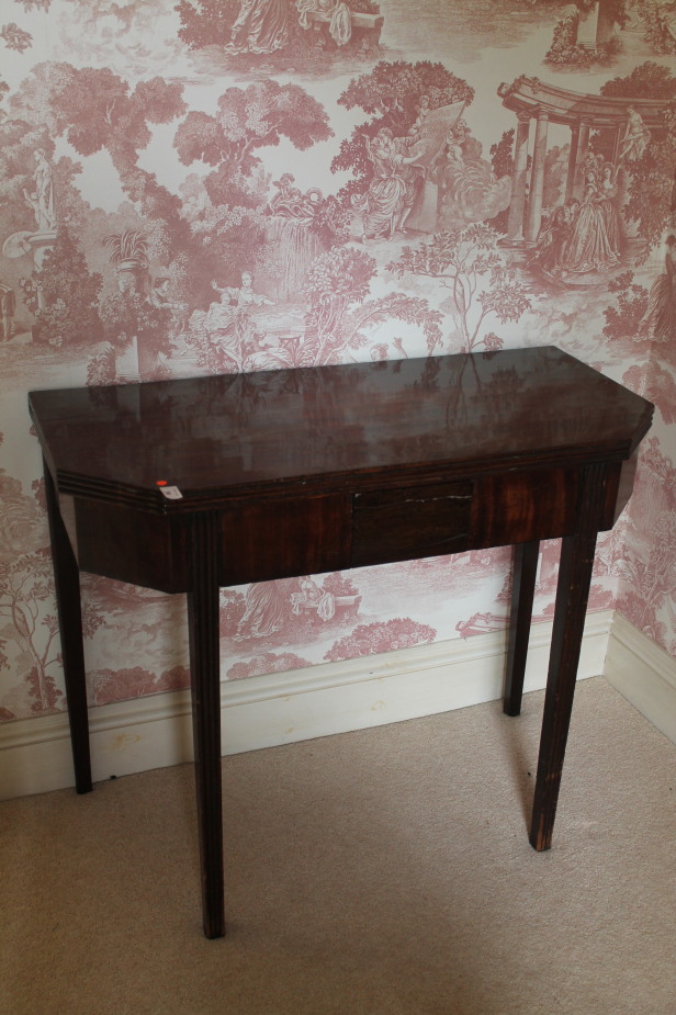 Appraisal: A George III mahogany tea table with reeded and canted