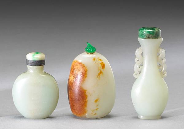 Appraisal: Three jade snuff bottles The first a flattened globular bottle