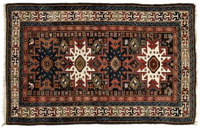 Appraisal: Caucasian rug four central medallions on brown field possibly a