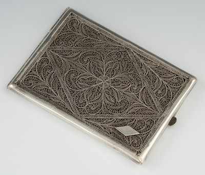 Appraisal: An Unmarked Silver Filigree Cigarette Case The rectangular case measuring