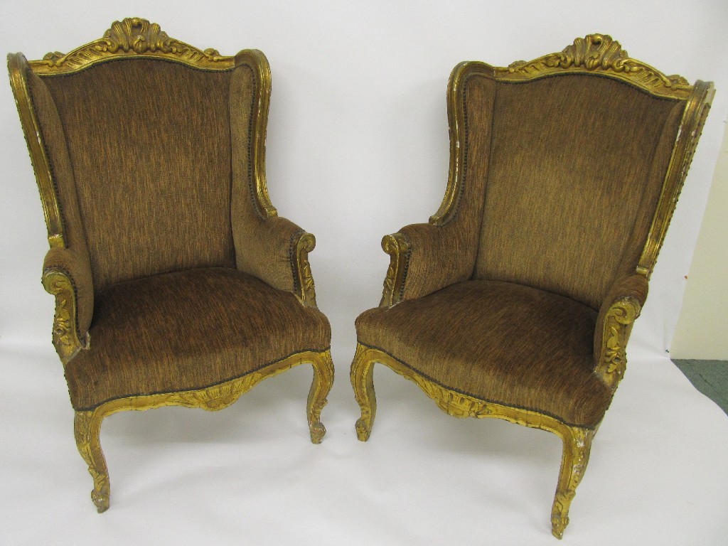 Appraisal: A pair of Victorian gilt gesso wing armchairs richly carved