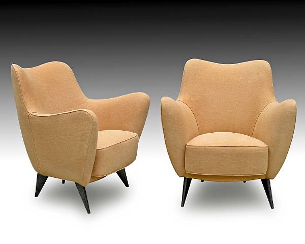 Appraisal: A pair of Gio Ponti upholstered armchairs s Each sculpted