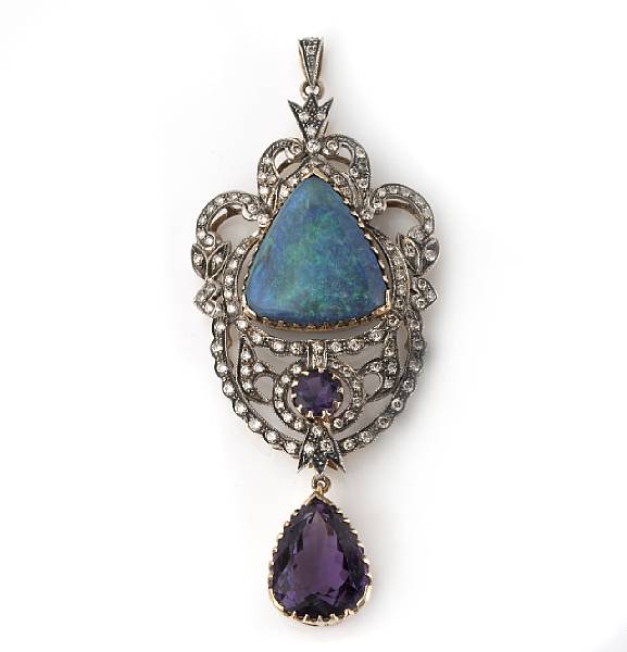 Appraisal: An opal amethyst diamond silver and gold pendant centering a