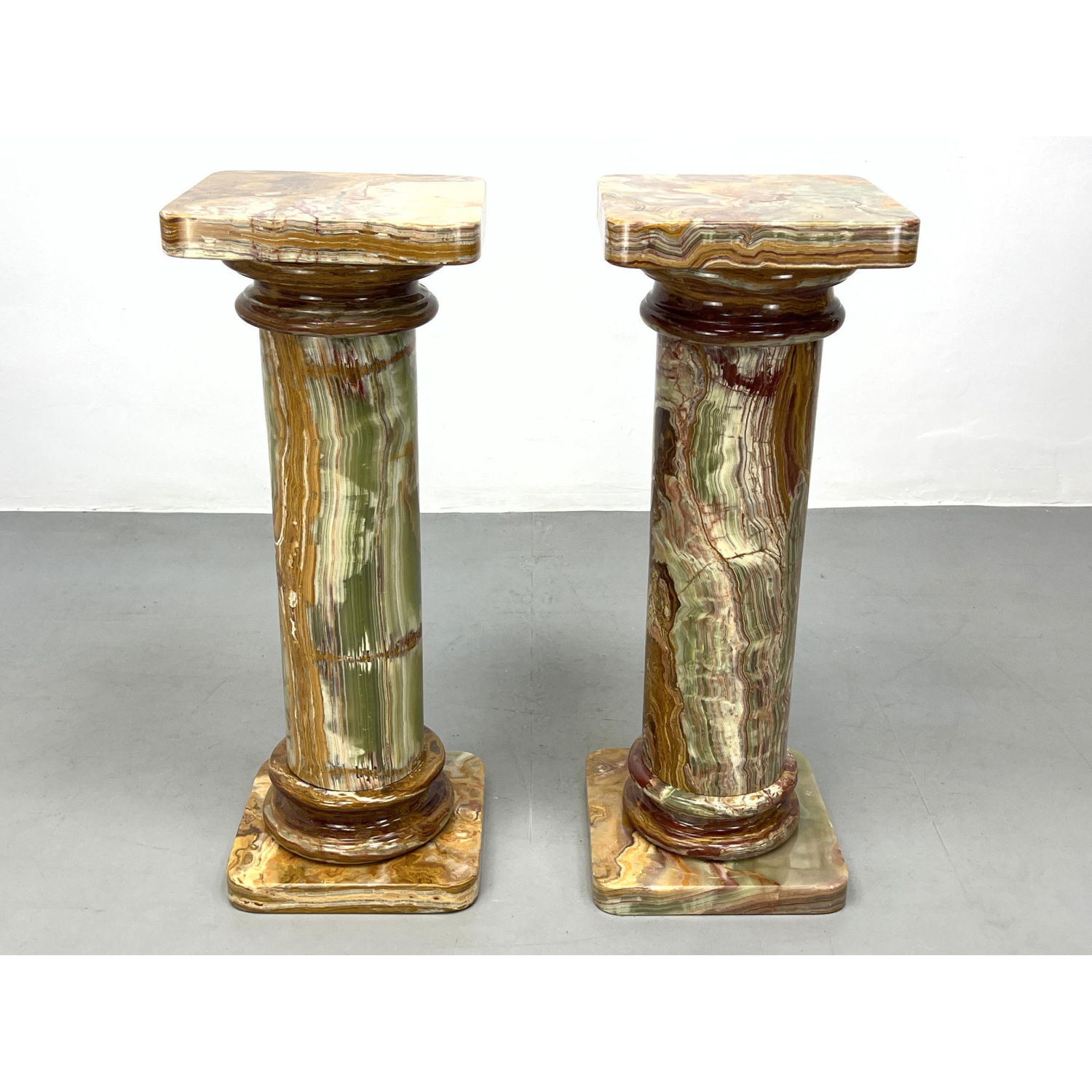 Appraisal: Pr Colorful Grained Green Onyx Display Pedestals Classical form Just