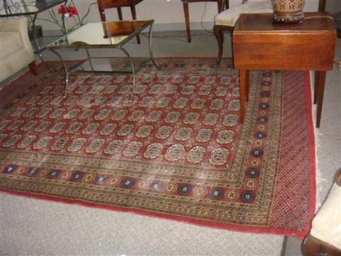 Appraisal: RED BLUE AND GOLD PAKISTANI ELEPHANT FOOT DESIGN TURROMAN RUG