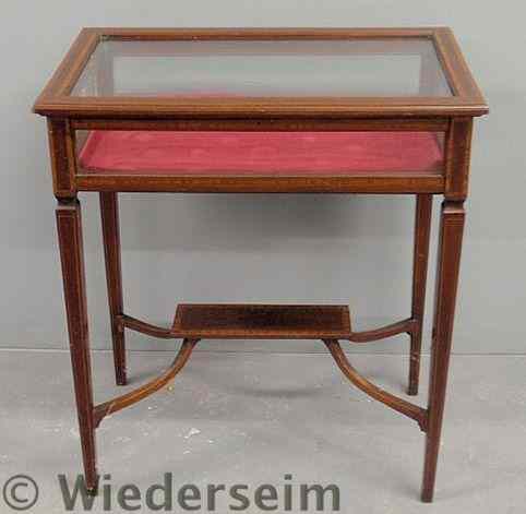 Appraisal: Inlaid mahogany curio table with tapered legs and lower shelf