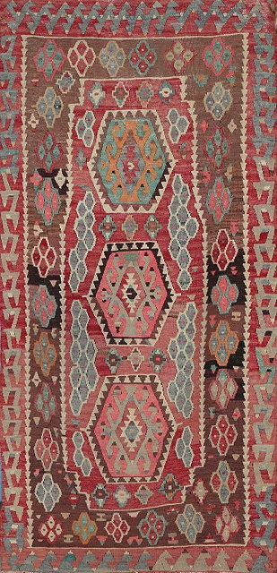 Appraisal: A TURKISH KELIM with three hexagonal medallions on a pastel