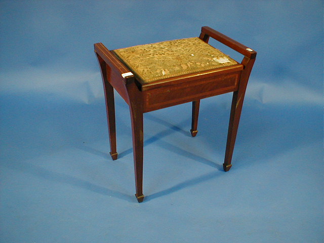 Appraisal: An Edwardian string inlaid mahogany piano stool