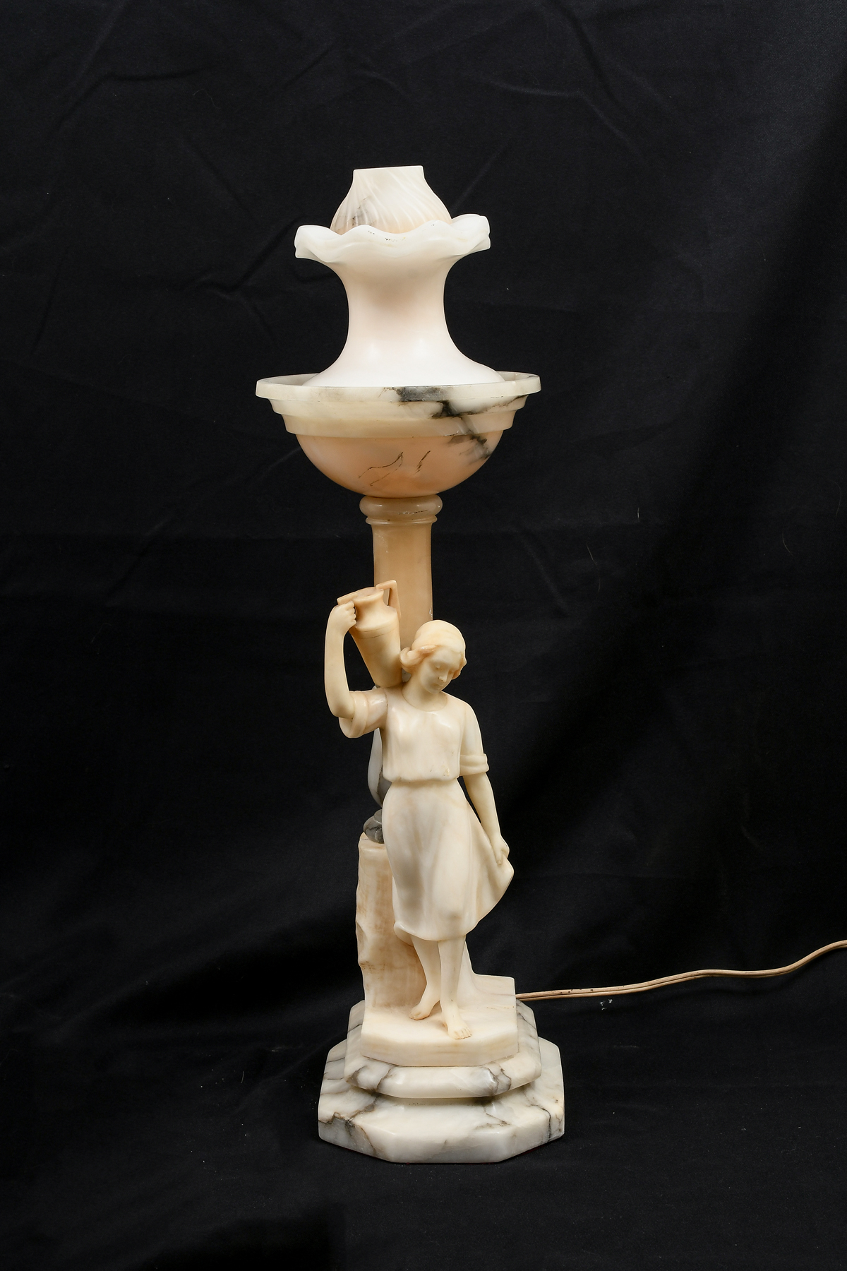 Appraisal: CARVED MARBLE FIGURAL LAMP Carved marble single light lamp having