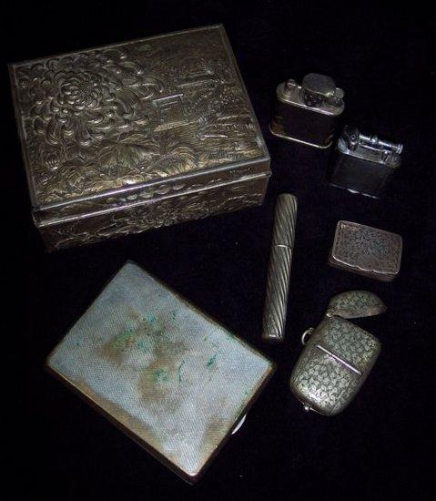 Appraisal: A snuff box the hinged rectangular lid engraved scrolls cm