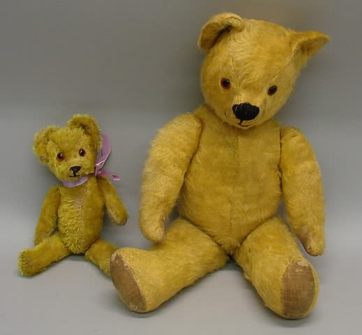 Appraisal: Pair of gold mohair bears with brown glass eyes embroidered