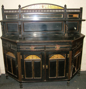 Appraisal: A Victorian ebonised sideboard the raised mirror back with floral