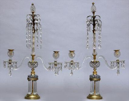 Appraisal: PAIR OF REGENCY-STYLE BRASS-MOUNTED CUT-GLASS TWO-LIGHT CANDELABRA Each tempietto base