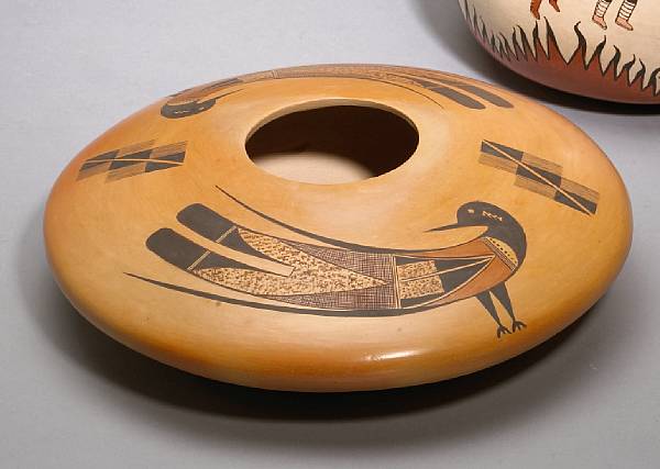 Appraisal: A Hopi polychrome jar Dextra Quotskuyva a seed jar with