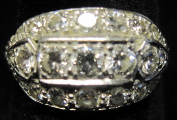 Appraisal: Platinum diamond ringDisplays twenty-five petite round cut diamonds centering on