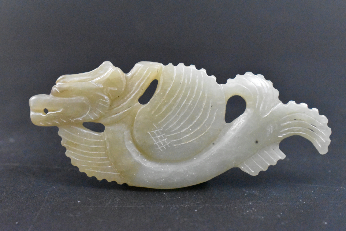 Appraisal: A Chinese jade carved dragon pendant dating from the Qing