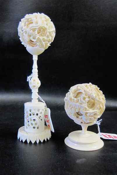 Appraisal: TWO CHINESE IVORY CARVED BALLS OF MYSTERY multiple layers on