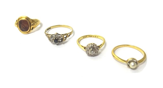 Appraisal: A gold and platinum diamond set nine stone cluster ring