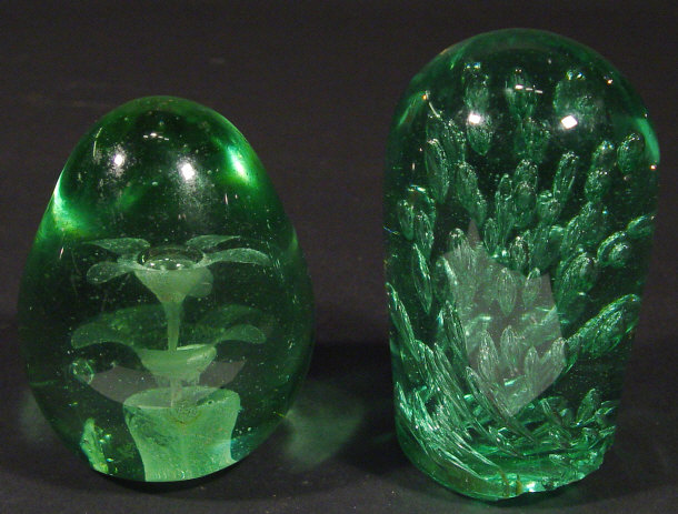 Appraisal: Two Victorian green glass dump weights with internal air bubbles