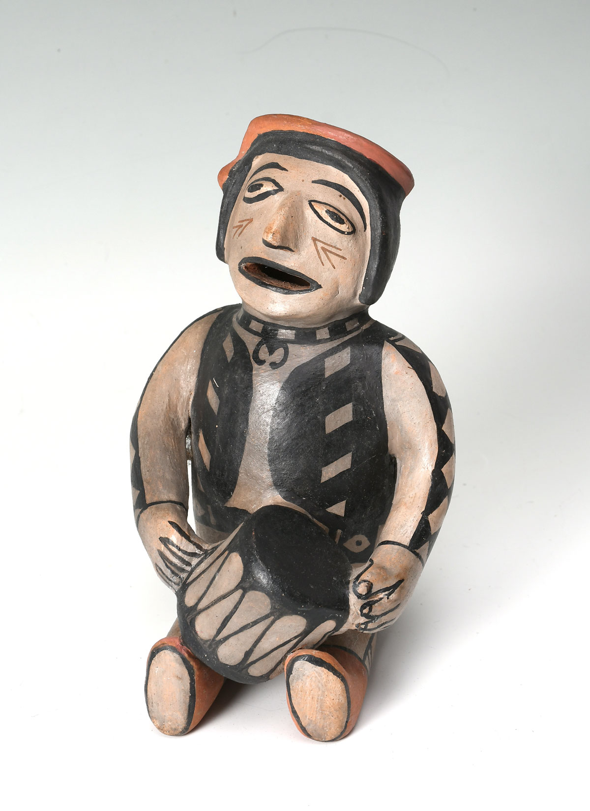 Appraisal: NATIVE AMERICAN COCHITA DRUMMER POTTERY FIGURINE Cochiti Pueblo pottery seated