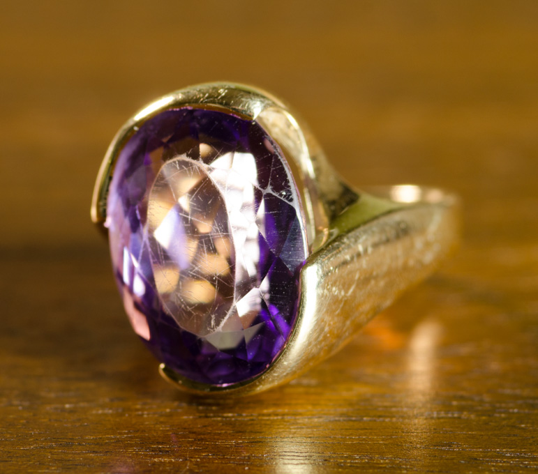 Appraisal: AMETHYST AND FOURTEEN KARAT GOLD RING set with a single