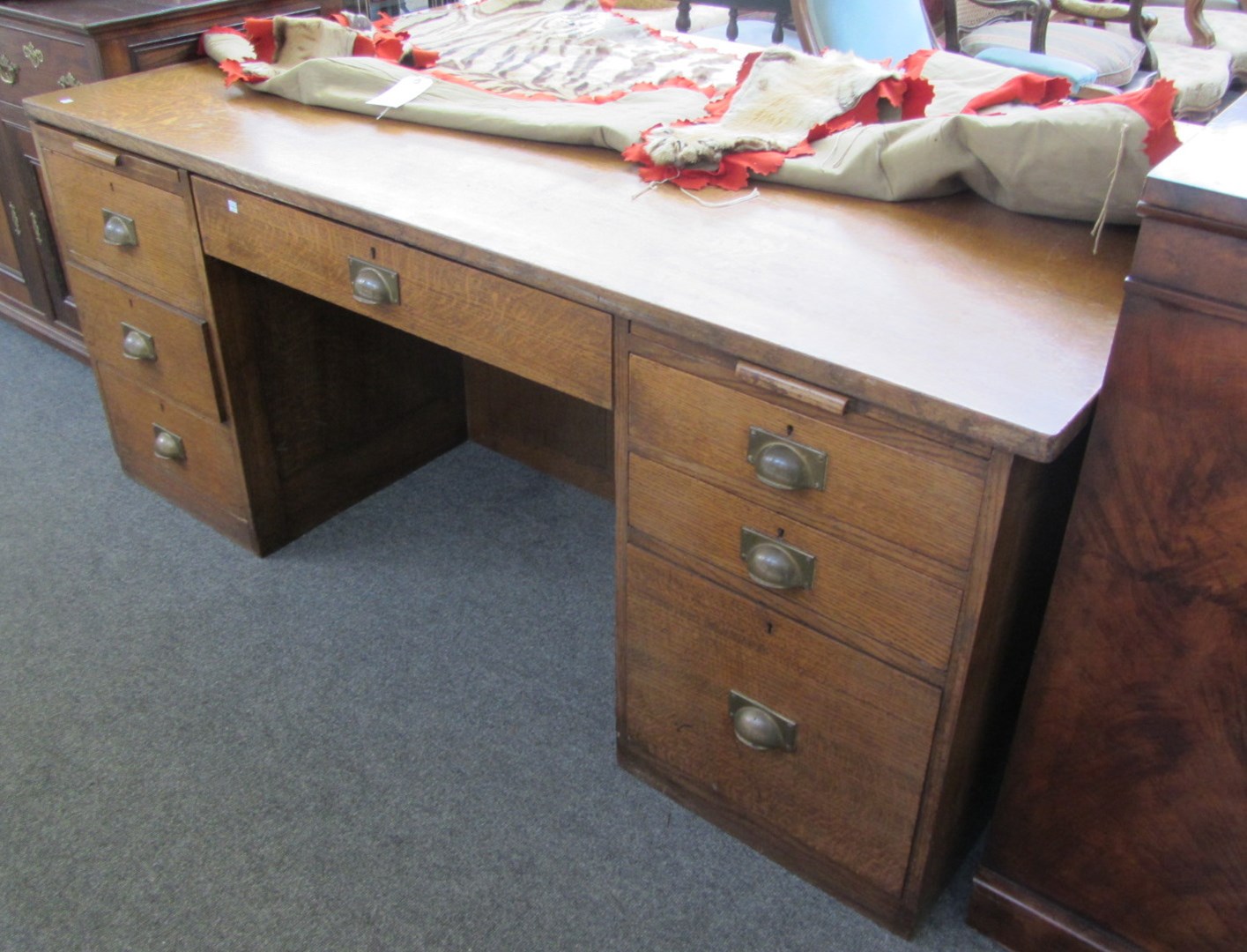 Appraisal: An early th century oak partners desk each pedestal with