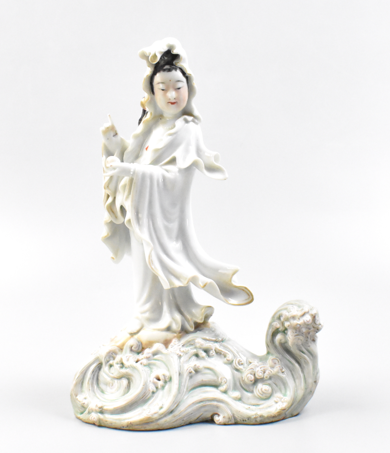 Appraisal: A Chinese porcelain Guanyin figure on a wave dating from