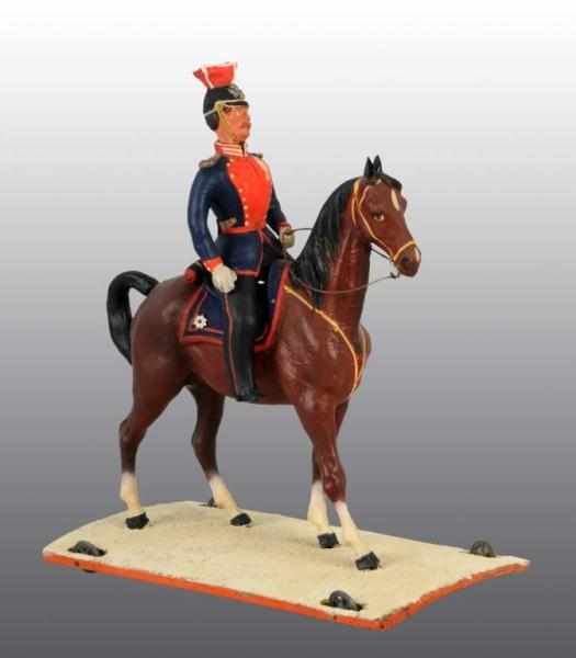 Appraisal: Composition Soldier Horse Platform Toy Description Appears to be a