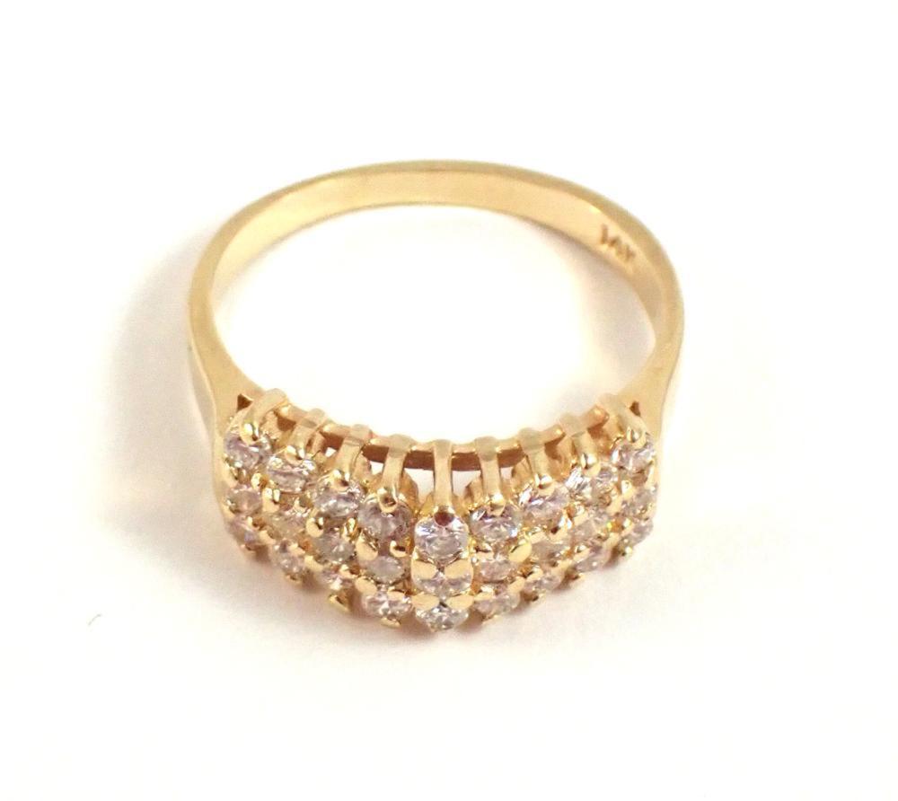 Appraisal: DIAMOND AND FOURTEEN KARAT GOLD RING set with three arched