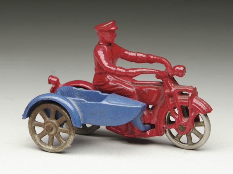 Appraisal: KILGORE MOTORCYCLE AND SIDECAR Red enameled motorcycle with cop with