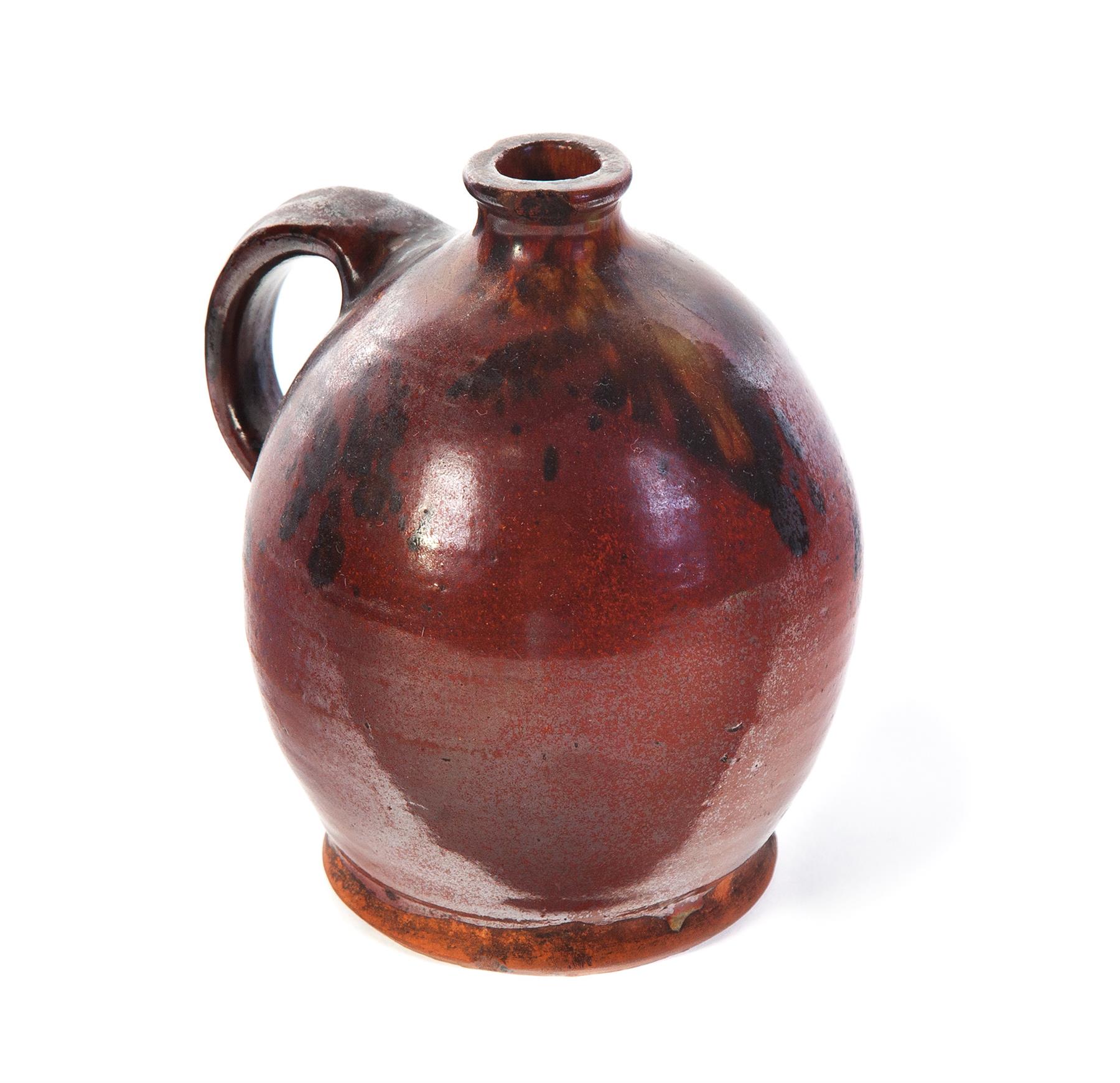 Appraisal: AMERICAN REDWARE JUG Mid th century Ovoid with applied strap