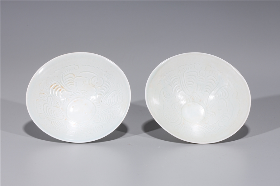 Appraisal: Pair of Chinese Song dynasty style Dingyao glaze tea bowls