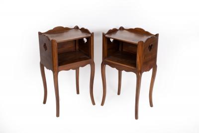 Appraisal: A pair of mahogany bedside cupboards with galleried tops and